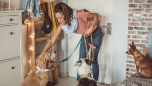 A professional pet sitter smiling while on a pet visit in Columbus, Ohio.